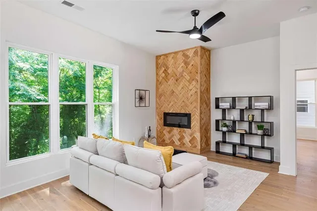 a living room with furniture and a fireplace