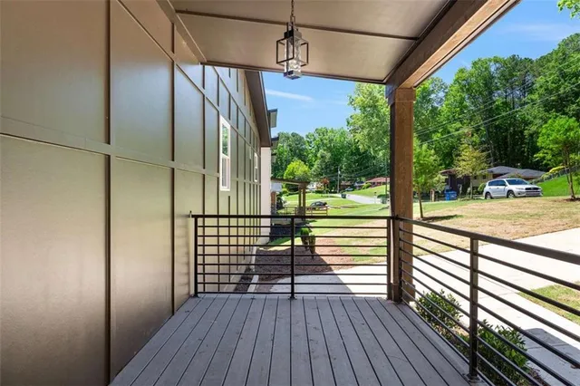 a view of a balcony with wooden floor