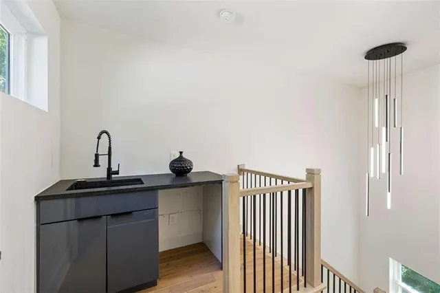 a kitchen with a sink and a window