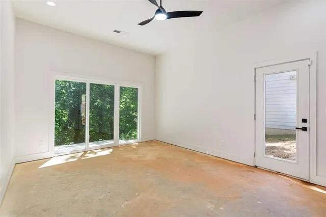 a view of an empty room with a window