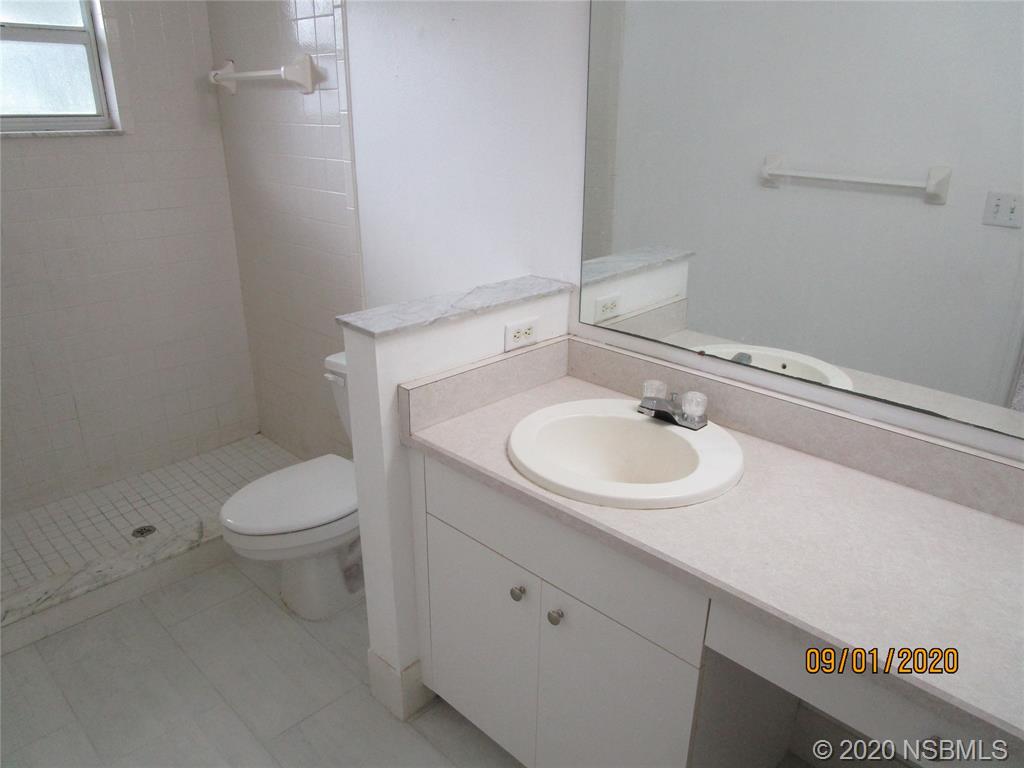 508 Sandpiper Court Edgewater, FL 32141 - Photo 6 of 10 a bathroom with a sink toilet and a mirror
