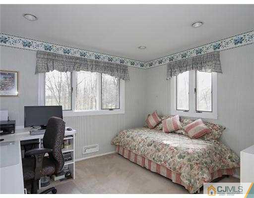 14 Golf Road Edison, NJ 08820 - Photo 12 of 20 a bedroom with a bed and a window
