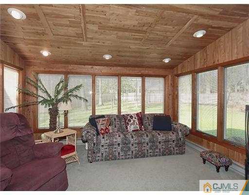 14 Golf Road Edison, NJ 08820 - Photo 14 of 20 a living room with furniture and a floor to ceiling window