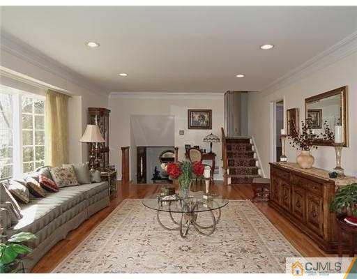 14 Golf Road Edison, NJ 08820 - Photo 15 of 20 a living room with furniture and a flat screen tv
