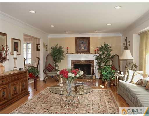 14 Golf Road Edison, NJ 08820 - Photo 3 of 20 a living room with furniture and a fireplace