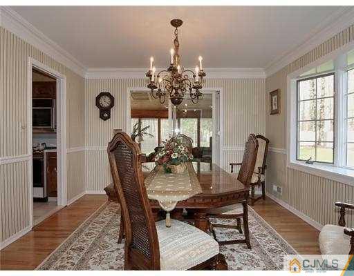 14 Golf Road Edison, NJ 08820 - Photo 4 of 20 a view of a dining room with furniture and a chandelier