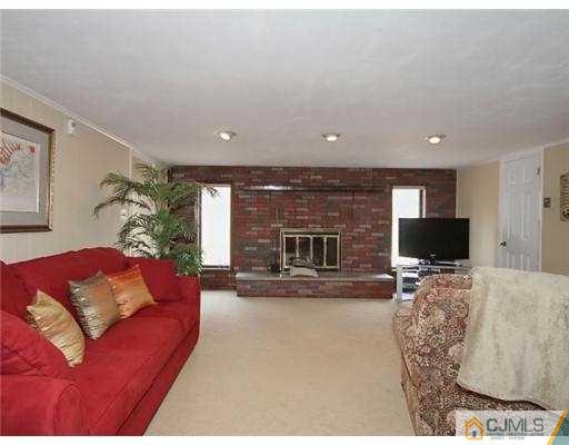 14 Golf Road Edison, NJ 08820 - Photo 10 of 20 a living room with furniture and a flat screen tv