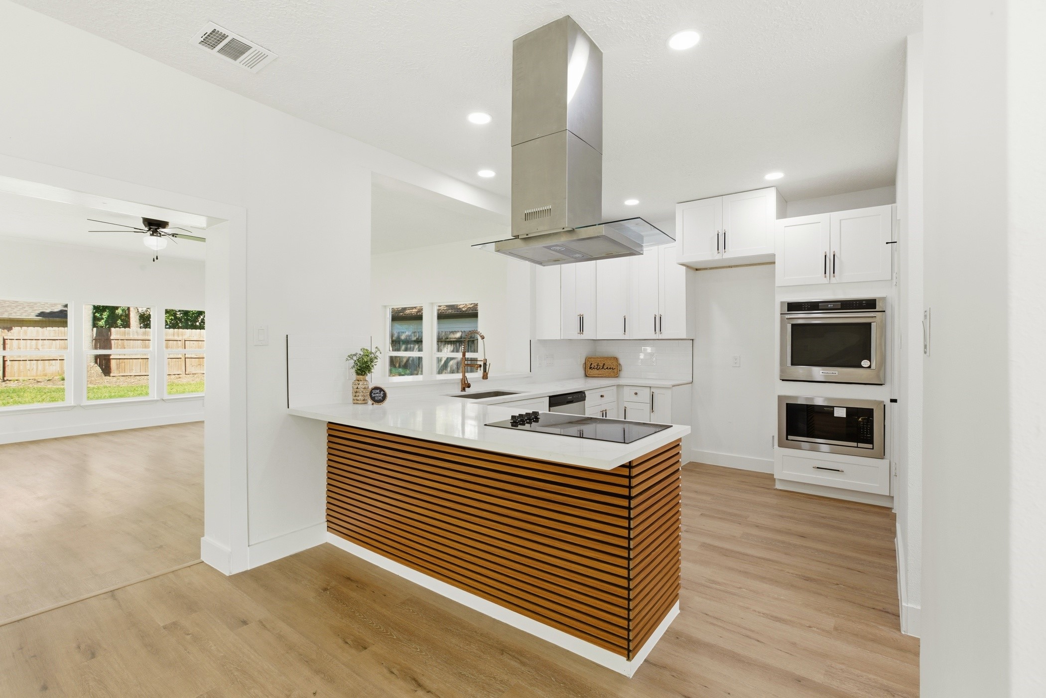 7338 San Ramon Drive Houston, TX 77083 - Photo 13 of 38 a kitchen view with stainless steel appliances a refrigerator and a sink