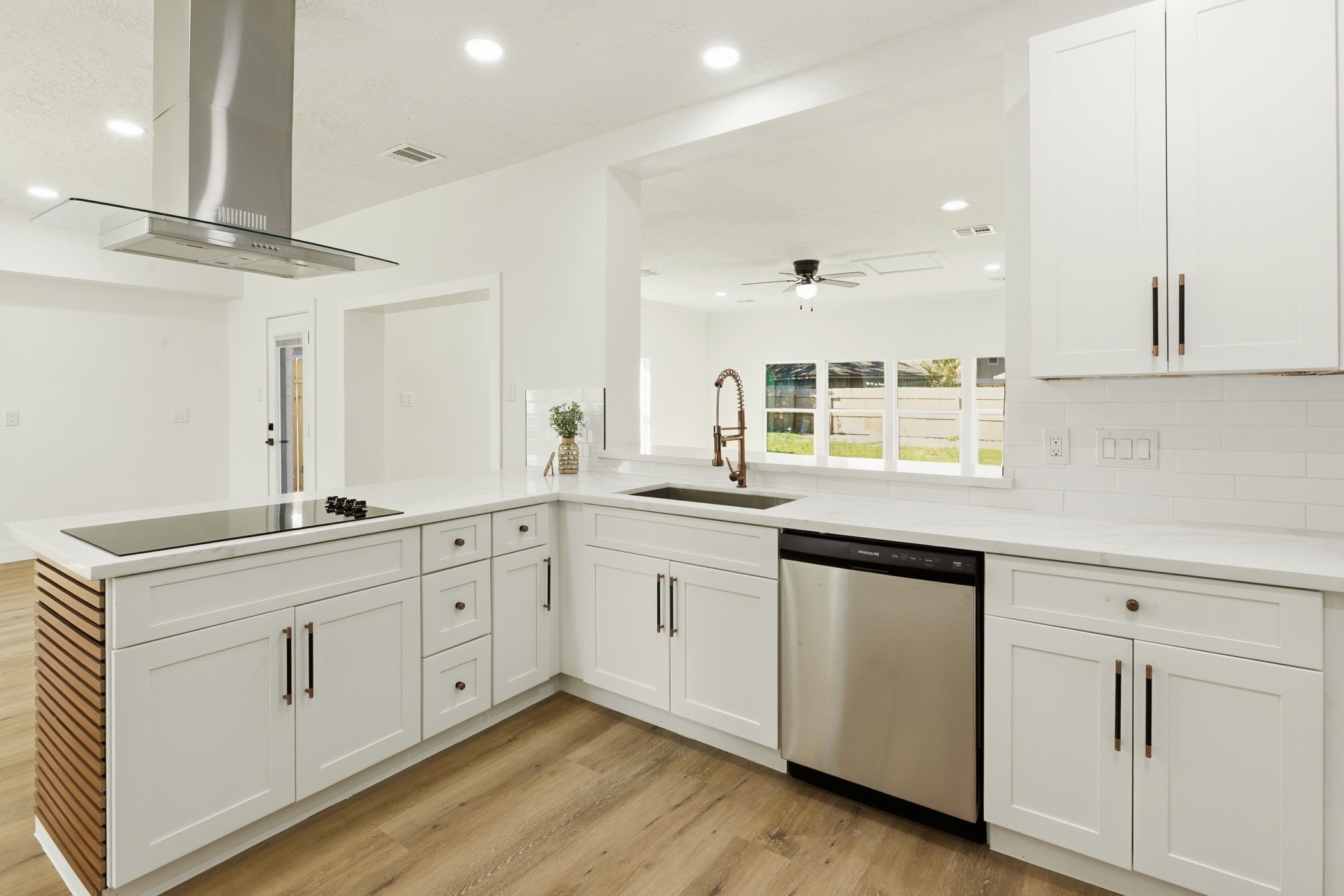 7338 San Ramon Drive Houston, TX 77083 - Photo 14 of 38 a kitchen with granite countertop white cabinets and white appliances