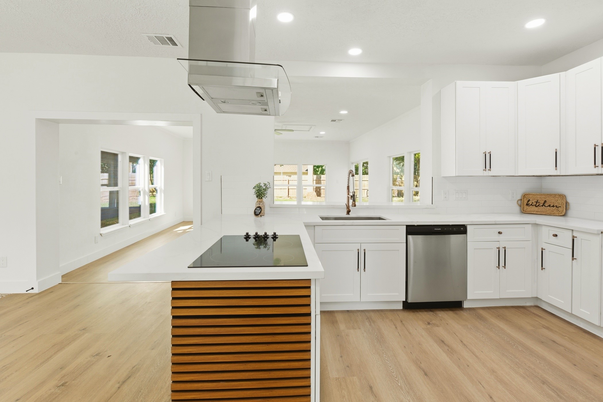7338 San Ramon Drive Houston, TX 77083 - Photo 16 of 38 a kitchen with cabinets a sink and appliances