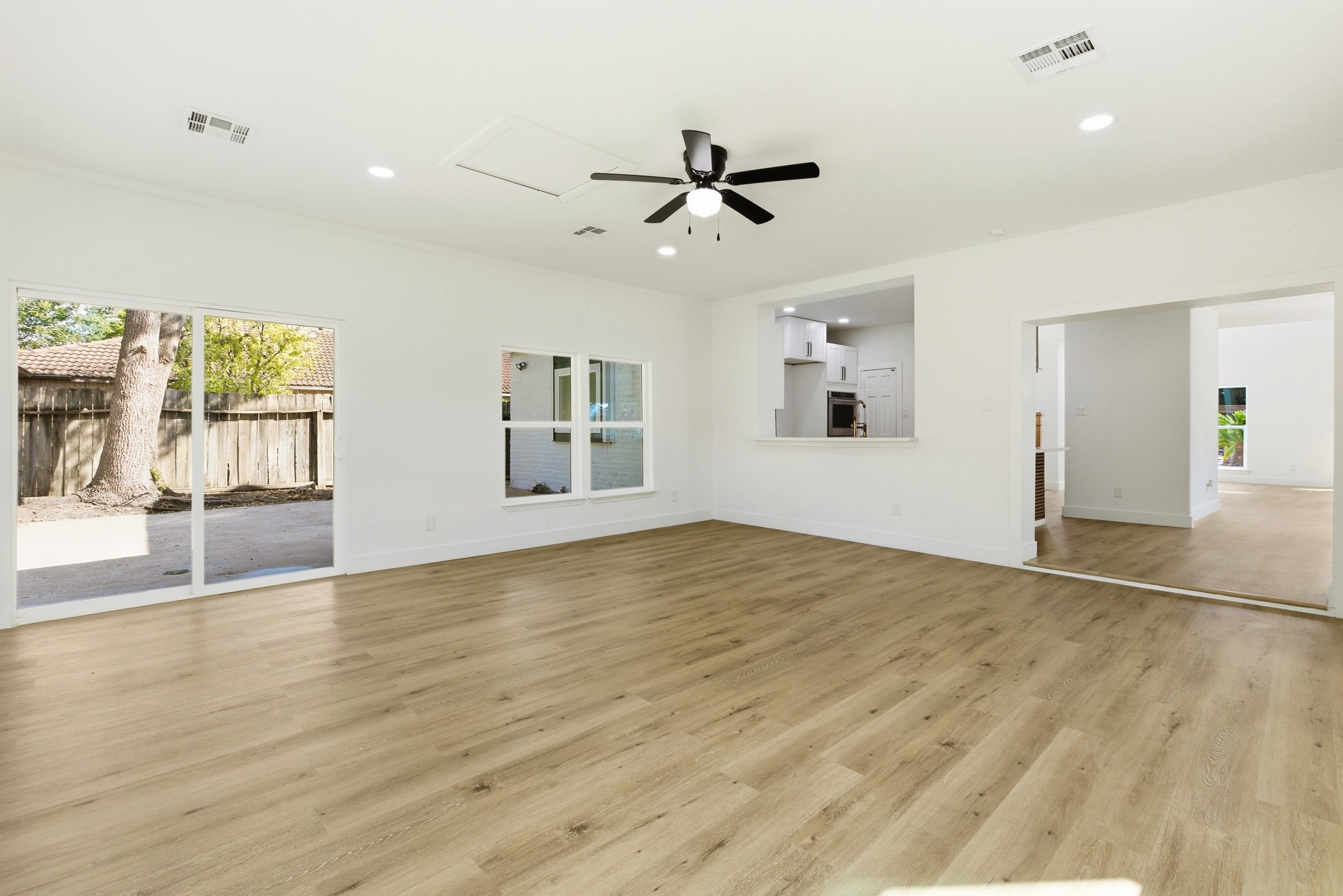 7338 San Ramon Drive Houston, TX 77083 - Photo 17 of 38 a view of empty room with wooden floor and fan