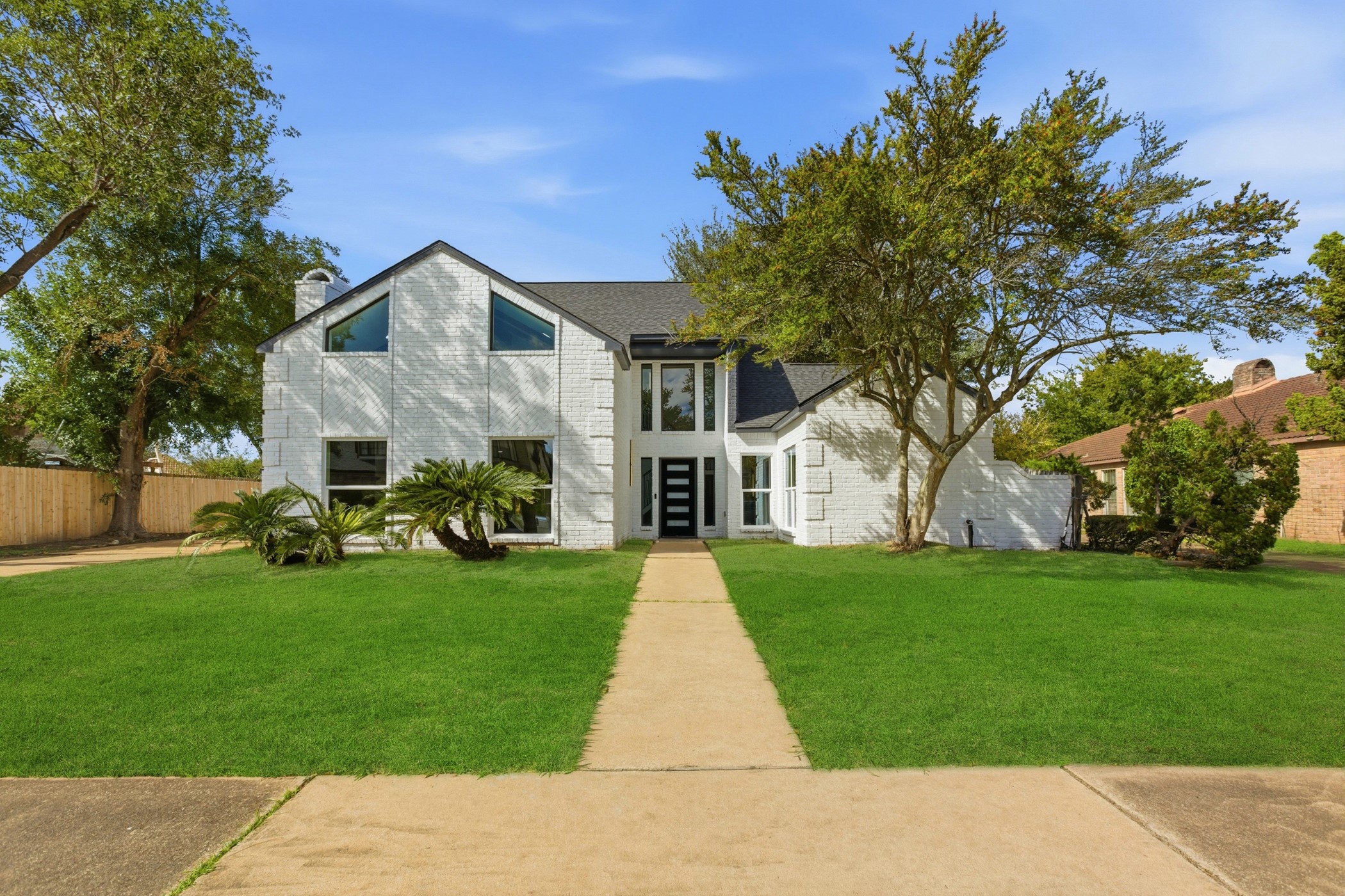 7338 San Ramon Drive Houston, TX 77083 - Photo 2 of 38 a front view of house with yard and green space