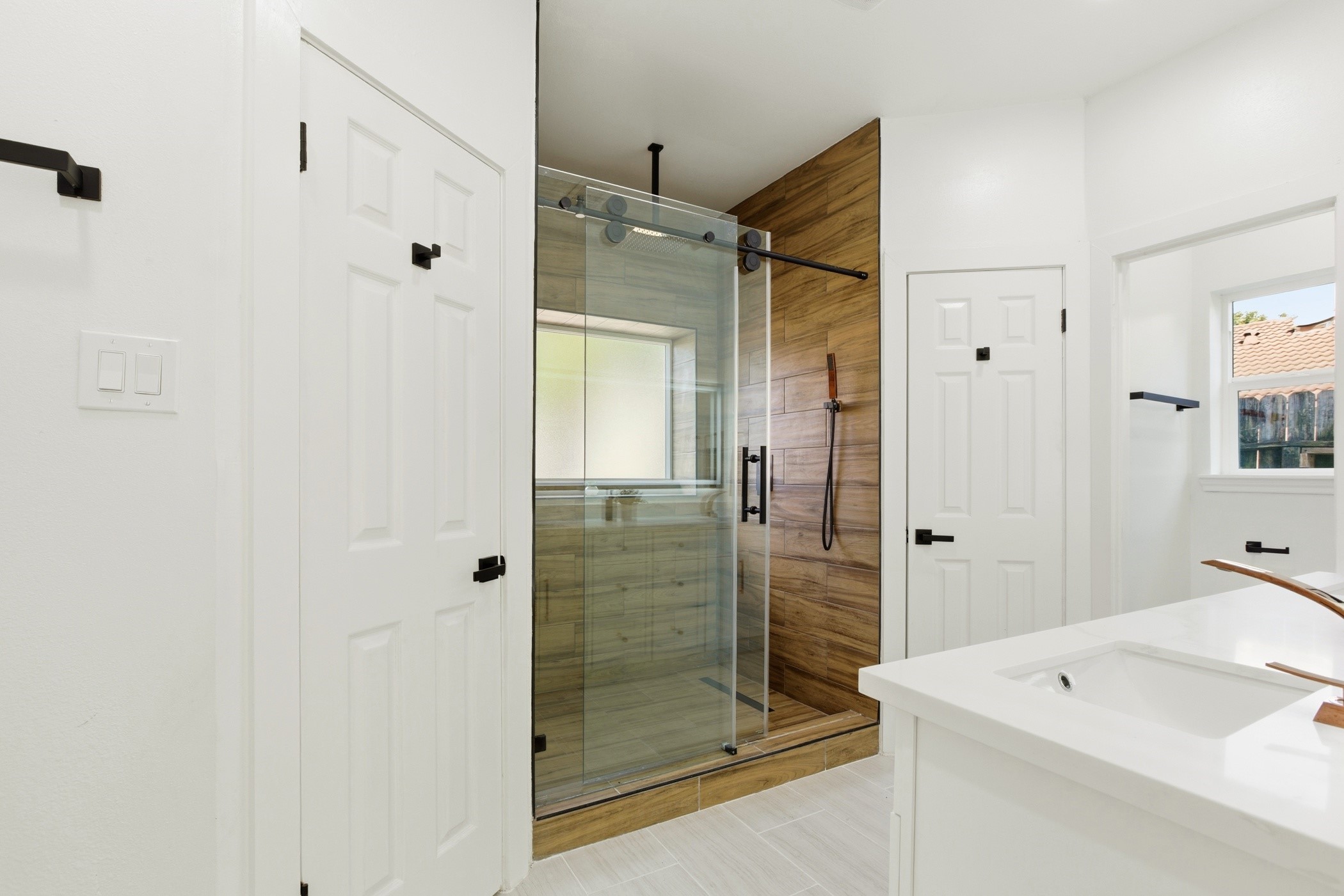 7338 San Ramon Drive Houston, TX 77083 - Photo 24 of 38 a bathroom with a shower and a sink