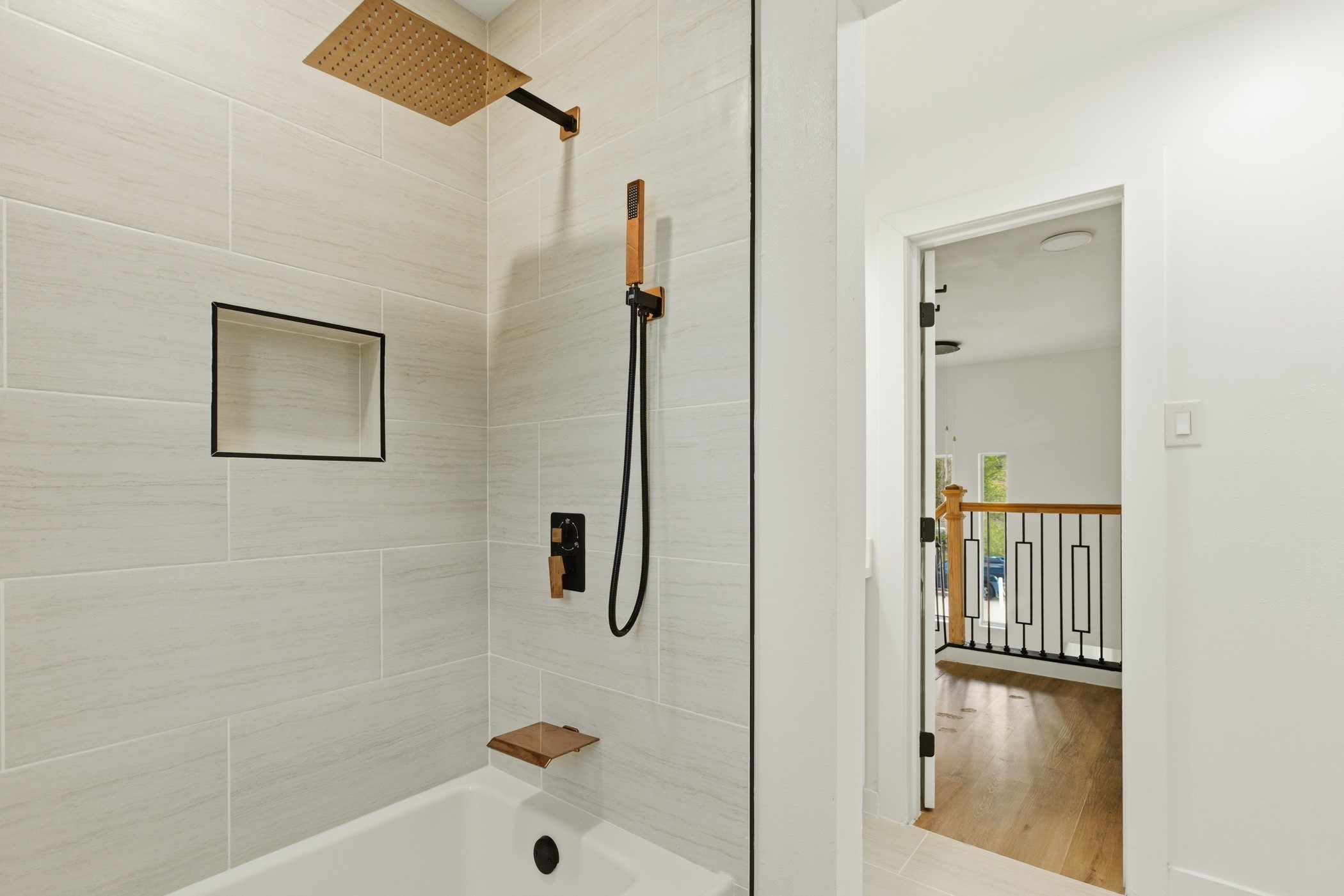 7338 San Ramon Drive Houston, TX 77083 - Photo 28 of 38 a bathroom with a bathtub and a shower