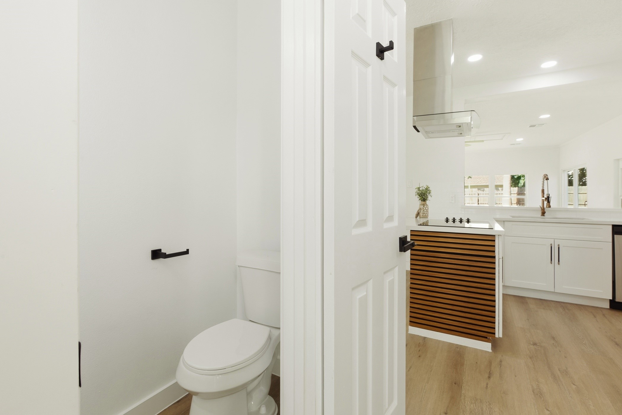 7338 San Ramon Drive Houston, TX 77083 - Photo 30 of 38 a bathroom with a sink a toilet and a mirror