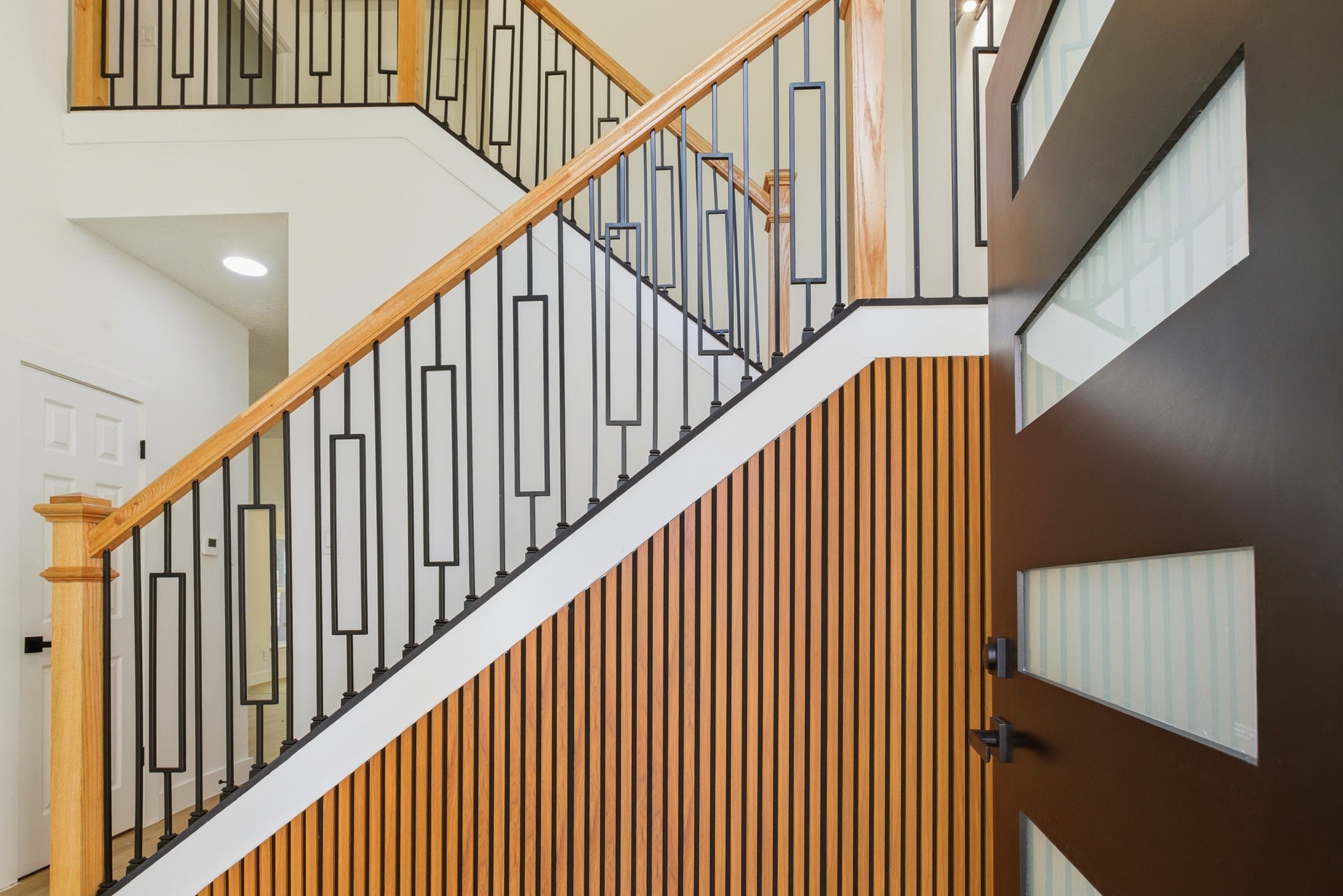 7338 San Ramon Drive Houston, TX 77083 - Photo 6 of 38 a view of staircase with railing and white walls