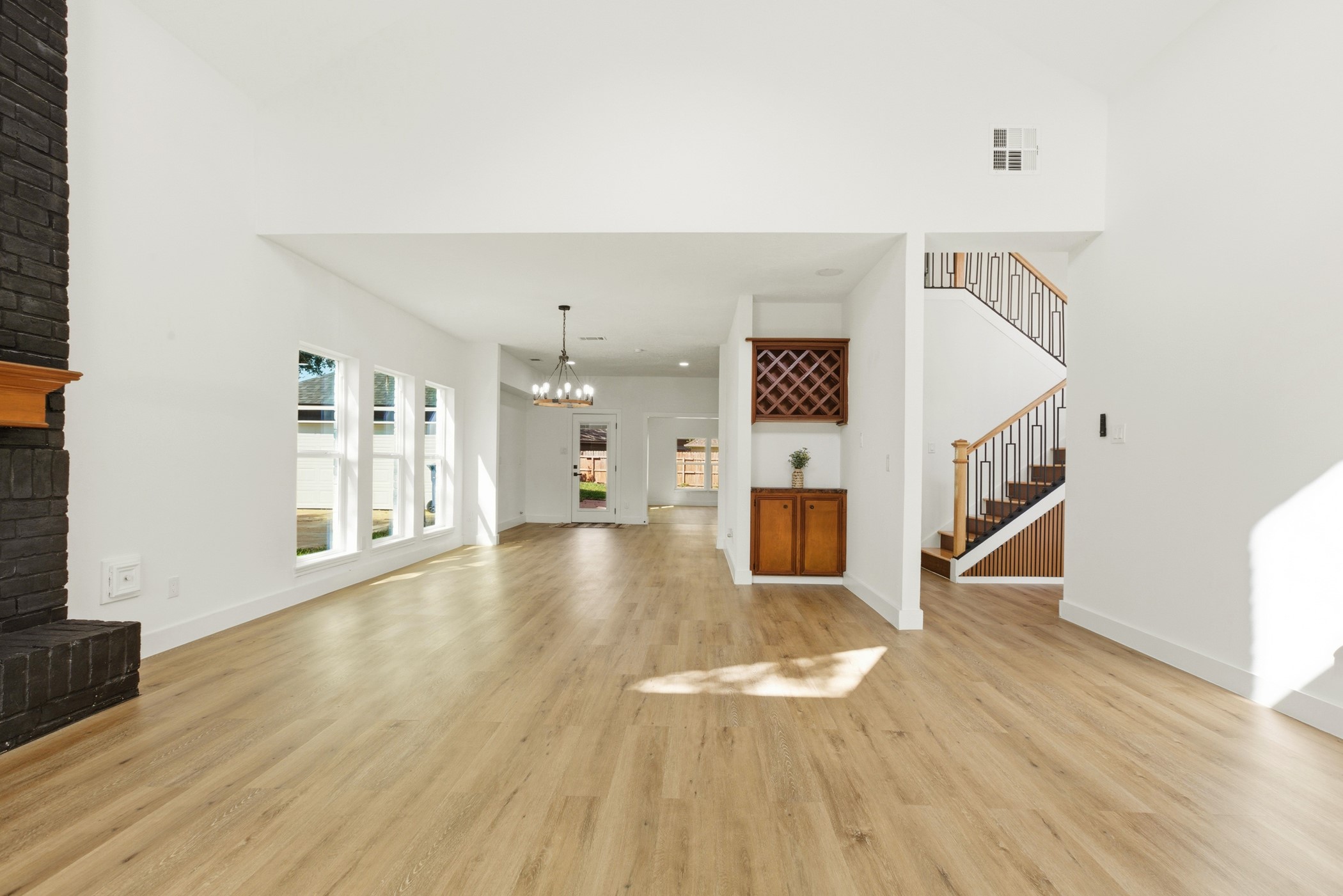 7338 San Ramon Drive Houston, TX 77083 - Photo 10 of 38 a view of a livingroom with wooden floor and stairs