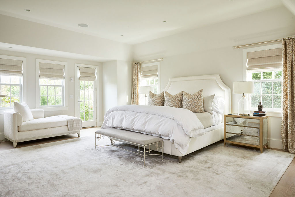 25 Pilgrim Road Nantucket, MA 02554 - Photo 16 of 28 a spacious bedroom with a bed and a couch with window