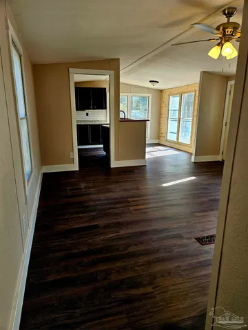 a kitchen with stainless steel appliances a stove a microwave and sink
