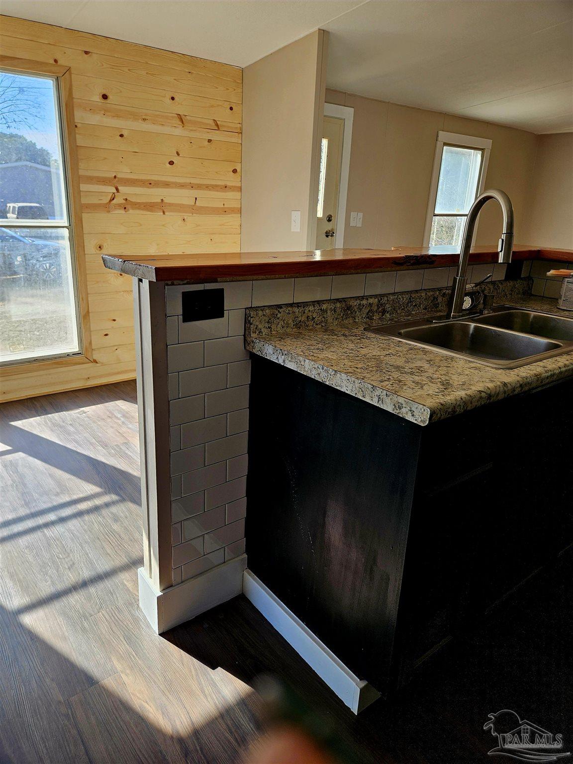 4240 Ewell Street Pace, FL 32571 - Photo 15 of 16 a view of kitchen island with sink
