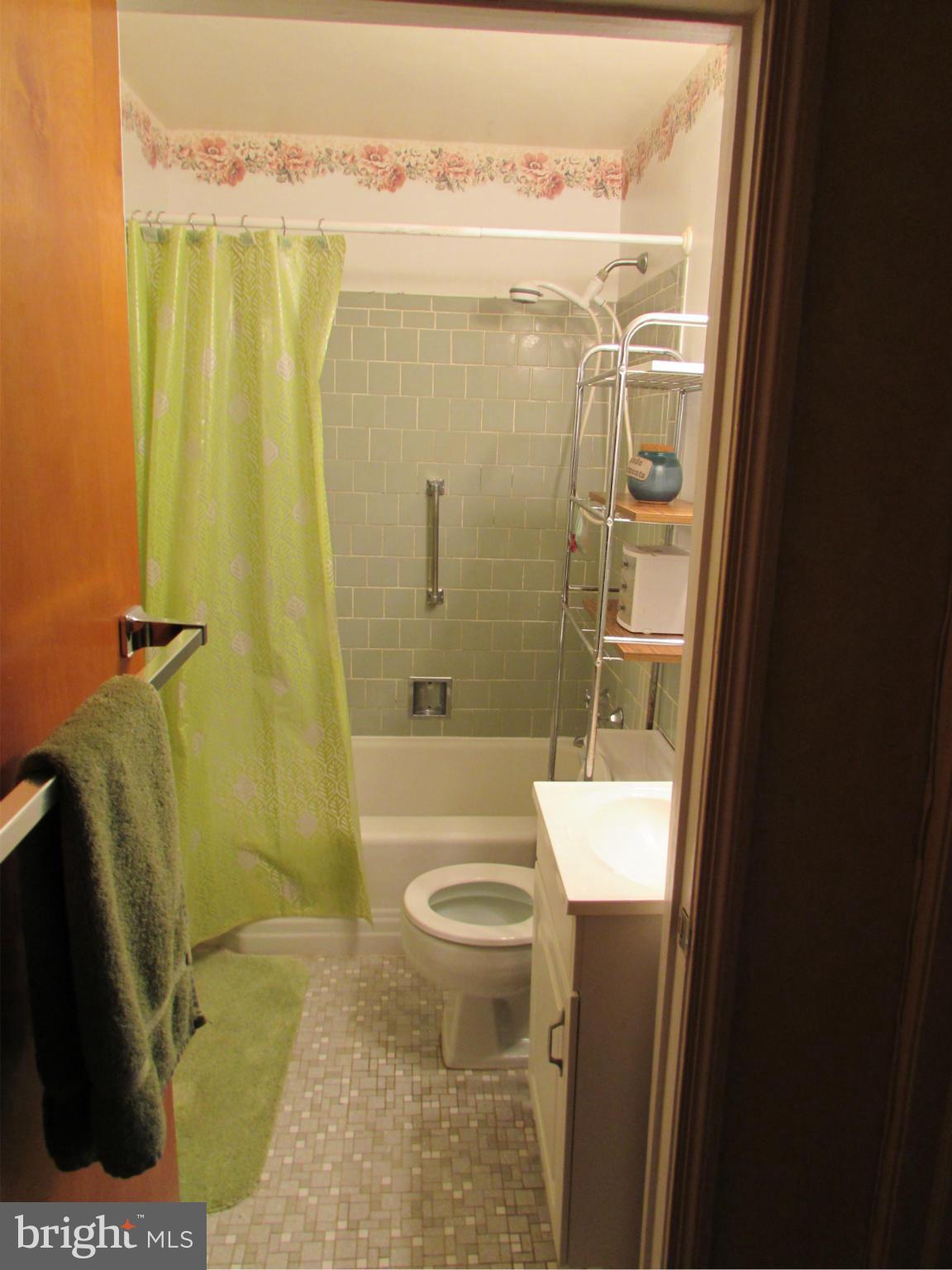 8617 Oak Road Baltimore, MD 21234 - Photo 11 of 16 a bathroom with a granite countertop sink toilet and shower