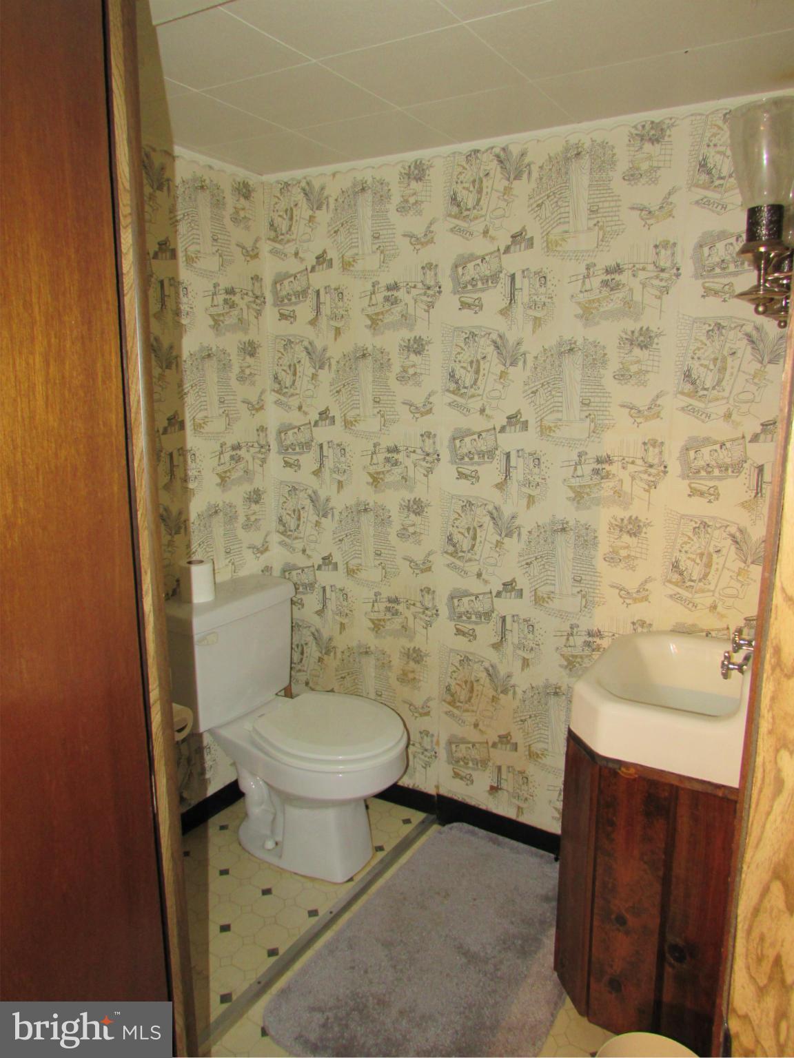 8617 Oak Road Baltimore, MD 21234 - Photo 12 of 16 a bathroom with a toilet and a shower