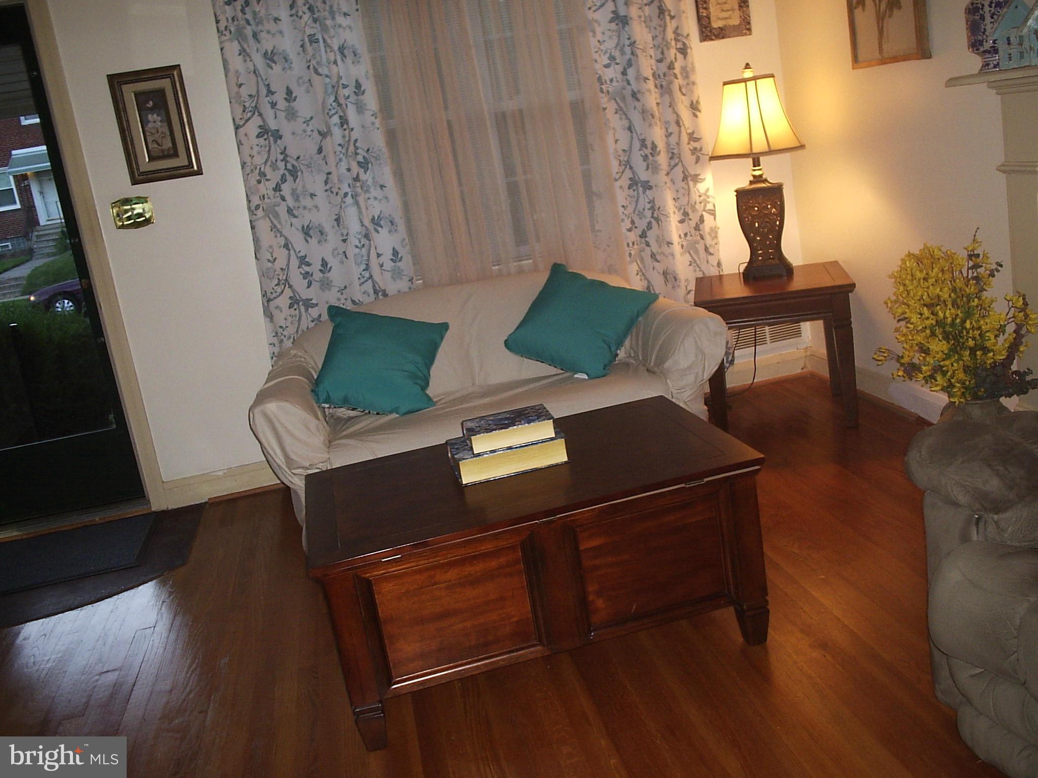 8617 Oak Road Baltimore, MD 21234 - Photo 3 of 16 a living room with furniture and a window