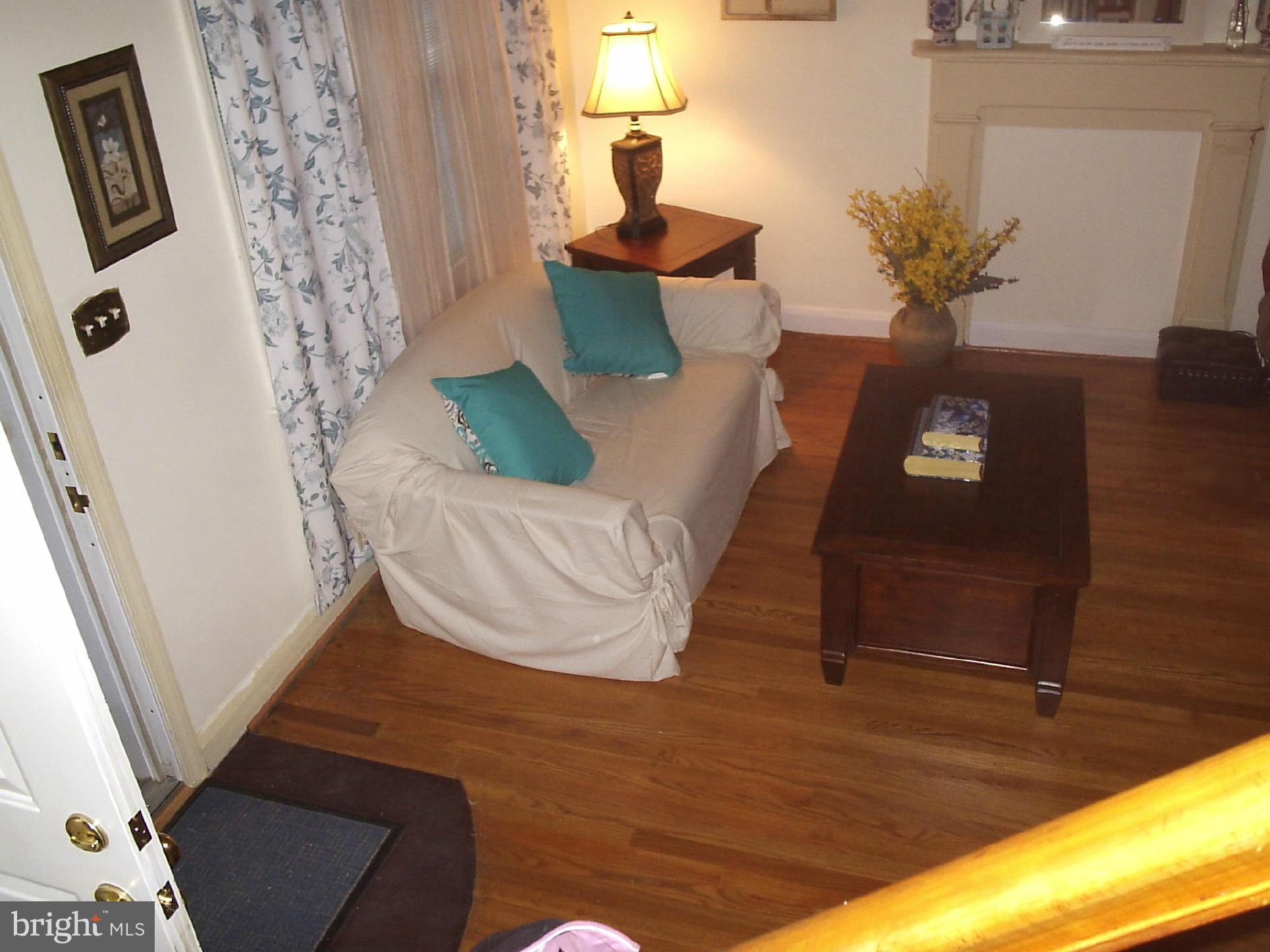 8617 Oak Road Baltimore, MD 21234 - Photo 4 of 16 a living room with furniture and a window