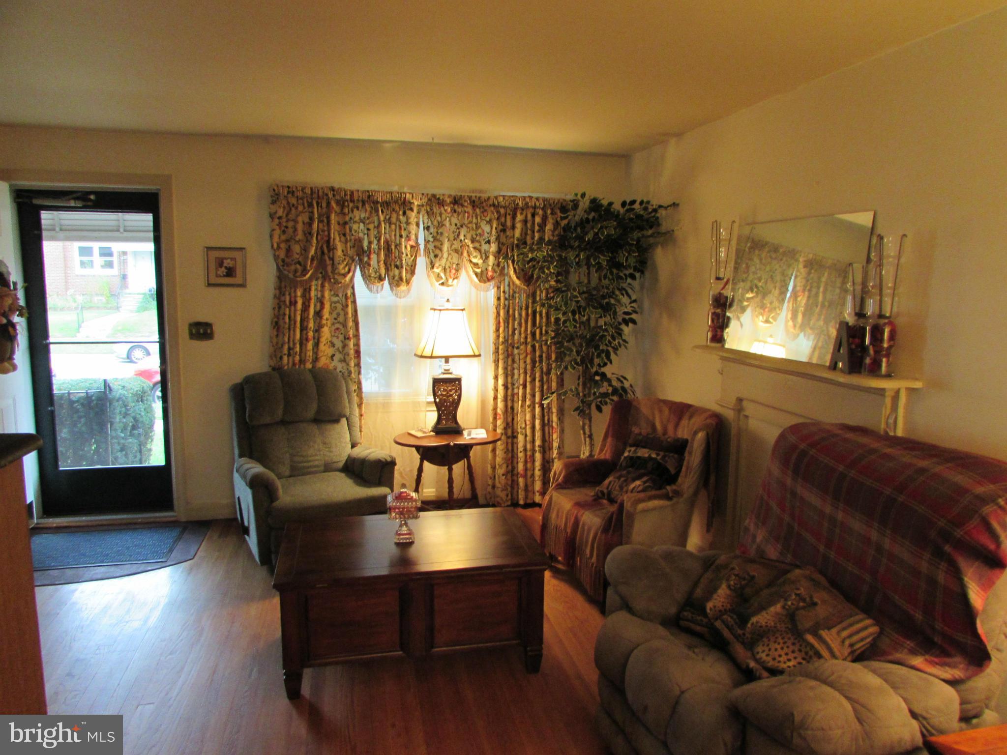 8617 Oak Road Baltimore, MD 21234 - Photo 7 of 16 a living room with furniture and a window