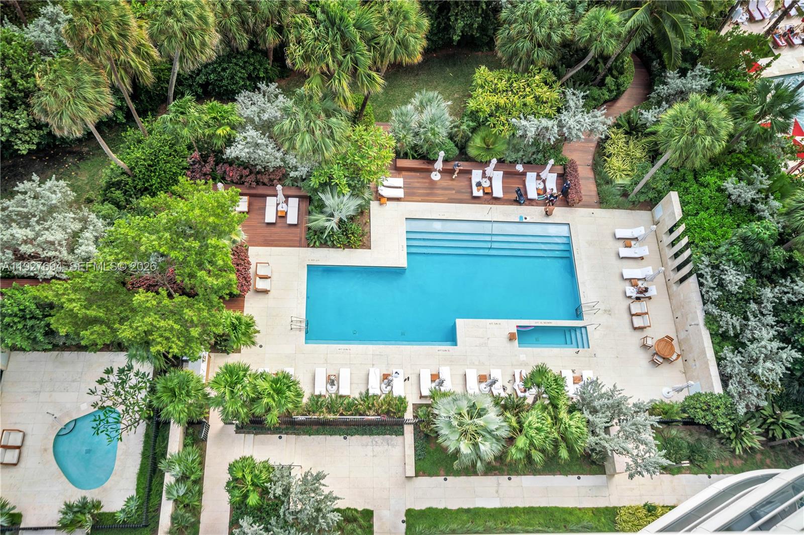 3315 Collins Avenue, Unit 10A Miami Beach, FL 33140 - Photo 47 of 48 an aerial view of a house with outdoor space swimming pool and lake view