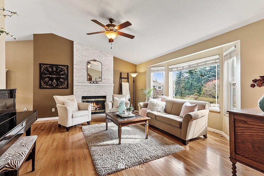 2523 243rd Place Southeast Bothell, WA 98021 - Photo 6 of 38 a living room with furniture and a fireplace