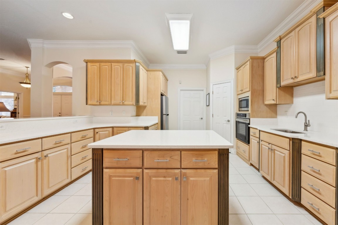 96075 High Pointe Drive Fernandina Beach, FL 32034 - Photo 13 of 42 a kitchen with a sink stove and cabinets