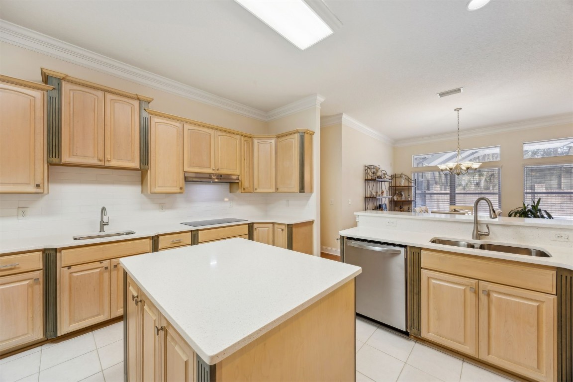 96075 High Pointe Drive Fernandina Beach, FL 32034 - Photo 16 of 42 a kitchen with white cabinets sink and stove