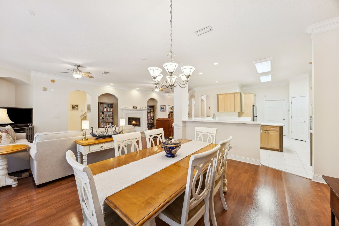 96075 High Pointe Drive Fernandina Beach, FL 32034 - Photo 17 of 42 a view of a dining room with furniture and wooden floor