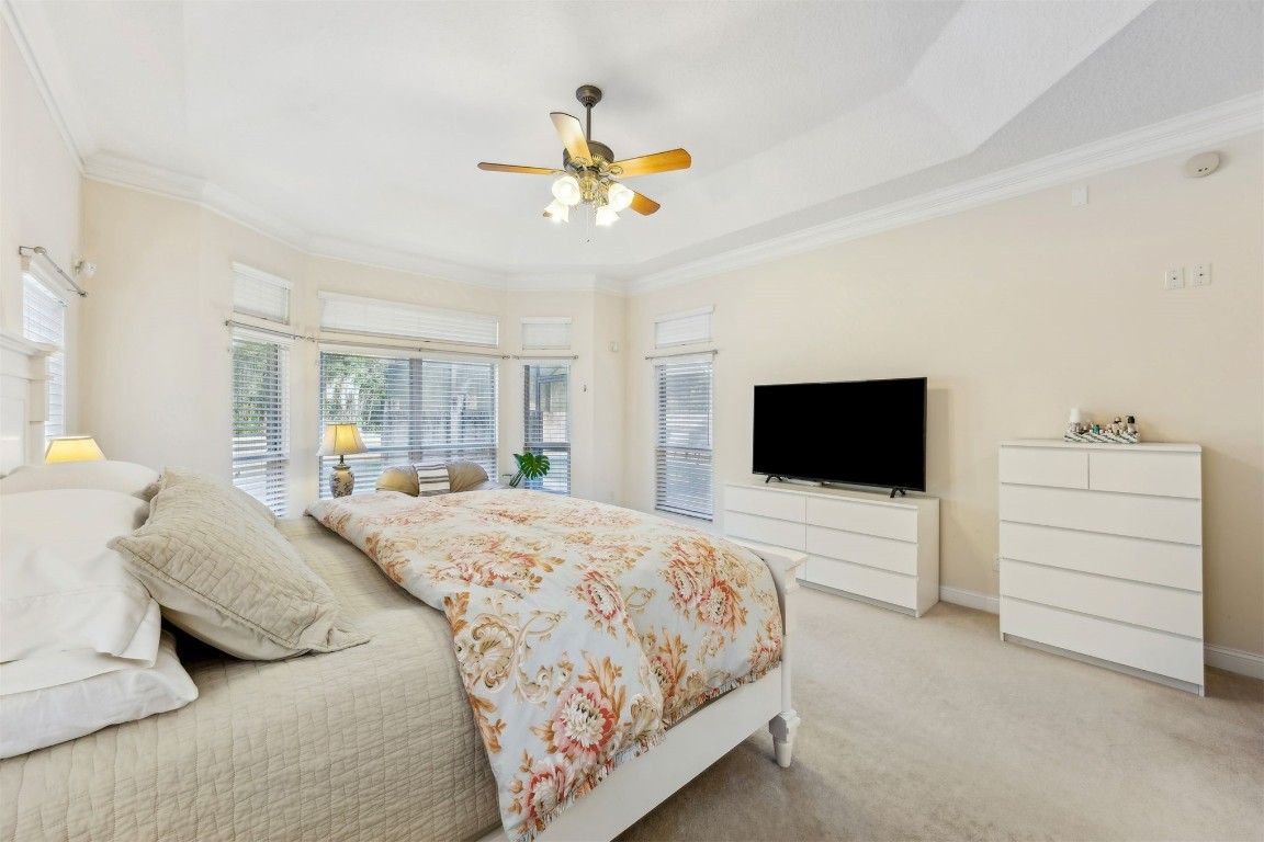 96075 High Pointe Drive Fernandina Beach, FL 32034 - Photo 18 of 42 a bedroom with a bed and a flat screen tv