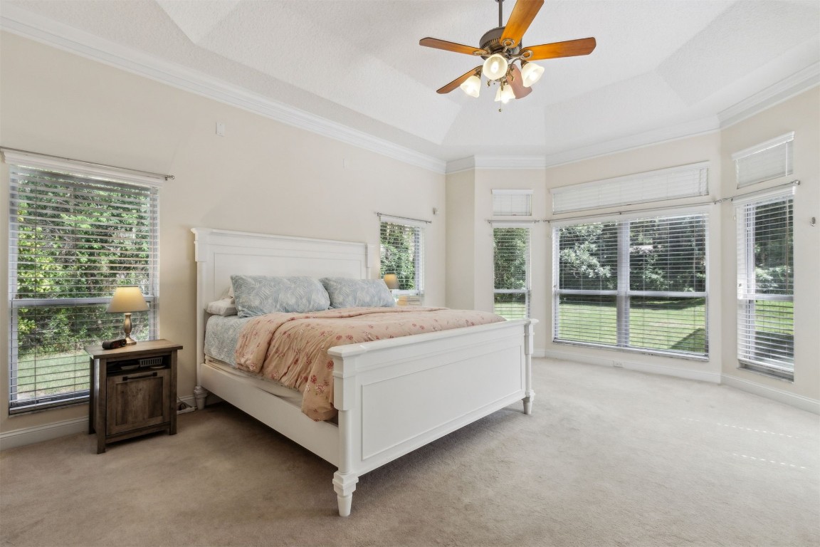 96075 High Pointe Drive Fernandina Beach, FL 32034 - Photo 19 of 42 a spacious bedroom with a bed and a large window