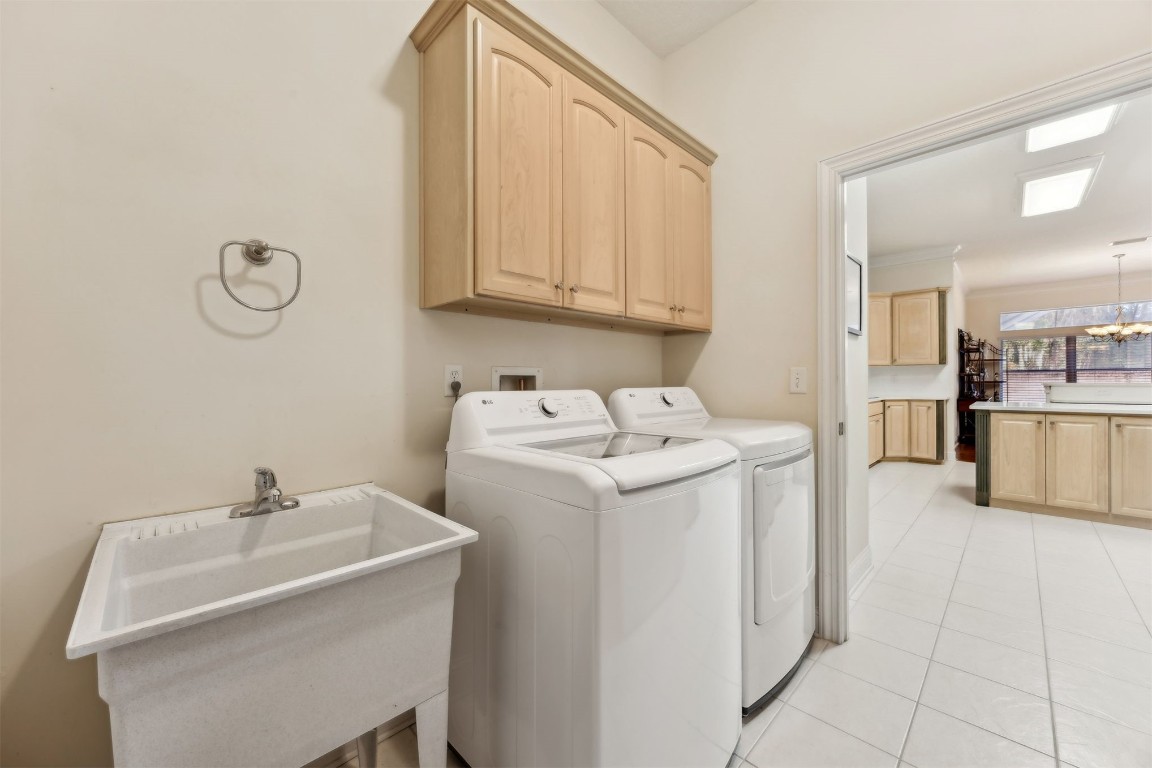 96075 High Pointe Drive Fernandina Beach, FL 32034 - Photo 28 of 42 a utility room with cabinets washer and dryer