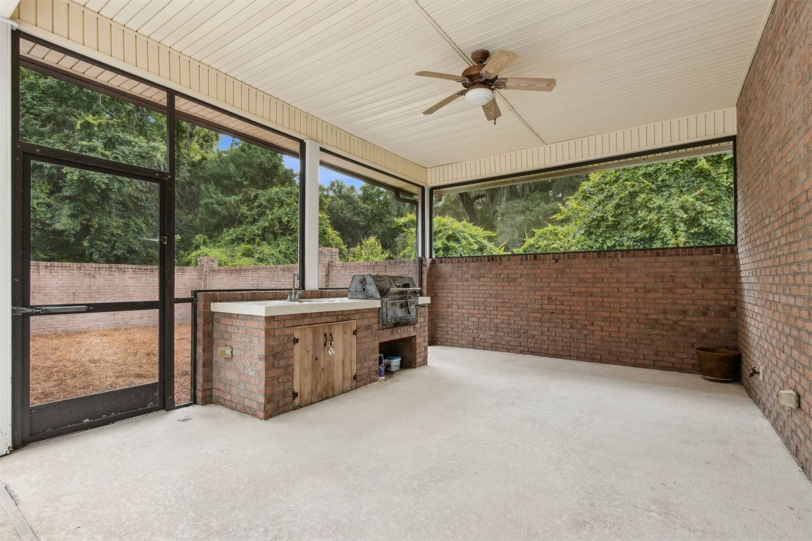 96075 High Pointe Drive Fernandina Beach, FL 32034 - Photo 30 of 42 en empty room with large windows and ceiling fan