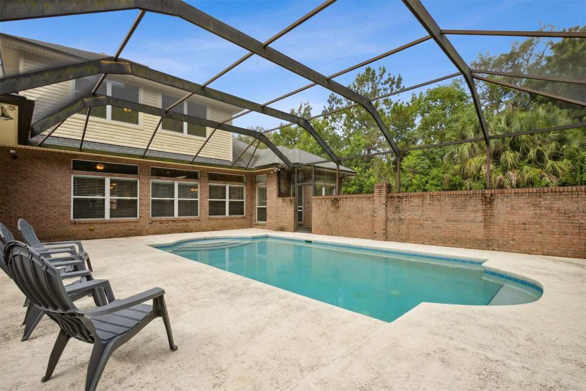 96075 High Pointe Drive Fernandina Beach, FL 32034 - Photo 31 of 42 a view of a backyard with a swimming pool
