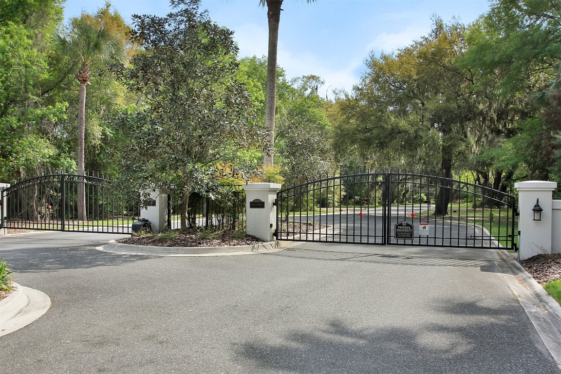 96075 High Pointe Drive Fernandina Beach, FL 32034 - Photo 38 of 42 a view of a street with a wooden fence