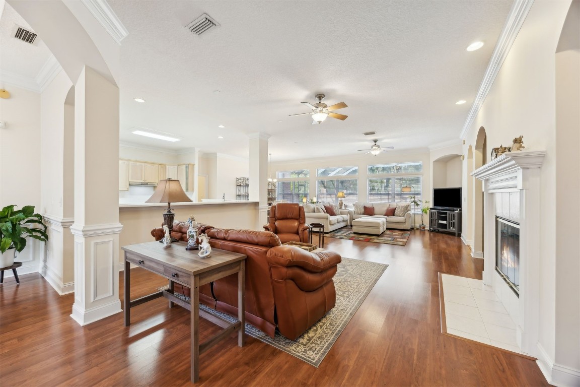 96075 High Pointe Drive Fernandina Beach, FL 32034 - Photo 7 of 42 a living room with furniture fireplace and wooden floor
