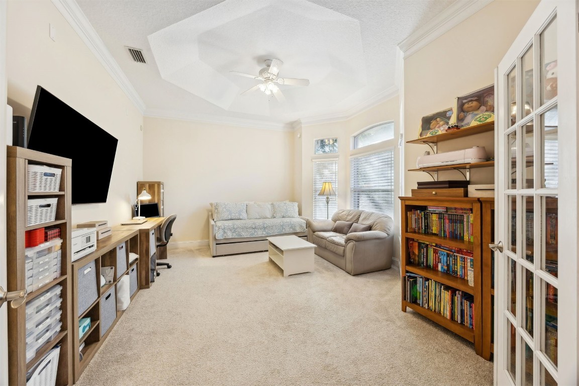 96075 High Pointe Drive Fernandina Beach, FL 32034 - Photo 8 of 42 a living room with furniture and a flat screen tv
