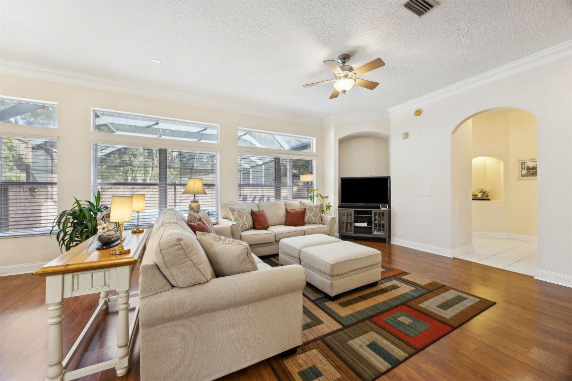 96075 High Pointe Drive Fernandina Beach, FL 32034 - Photo 10 of 42 a living room with furniture fireplace and wooden floor