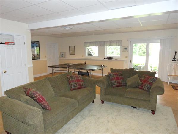 115 Gleasondale Road Stow, MA 01775 - Photo 12 of 14 a living room with furniture and a large window