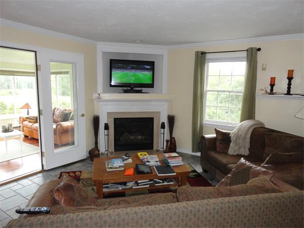 115 Gleasondale Road Stow, MA 01775 - Photo 5 of 14 a living room with furniture and a fireplace
