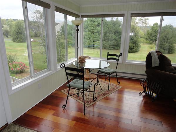 115 Gleasondale Road Stow, MA 01775 - Photo 6 of 14 a dining room with wooden floor and a glass door