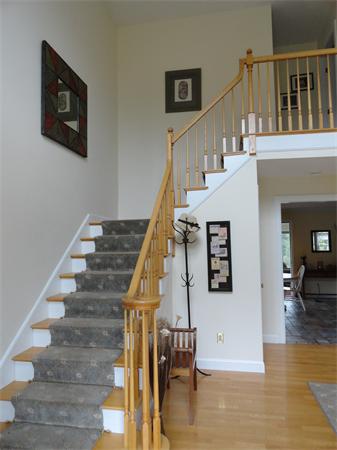 115 Gleasondale Road Stow, MA 01775 - Photo 7 of 14 a view of entryway and hall with wooden floor