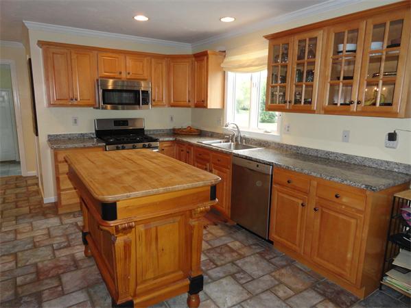 115 Gleasondale Road Stow, MA 01775 - Photo 10 of 14 a kitchen that has a sink and a stove in it