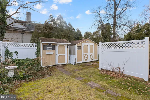a view of a table and chairs in back yard