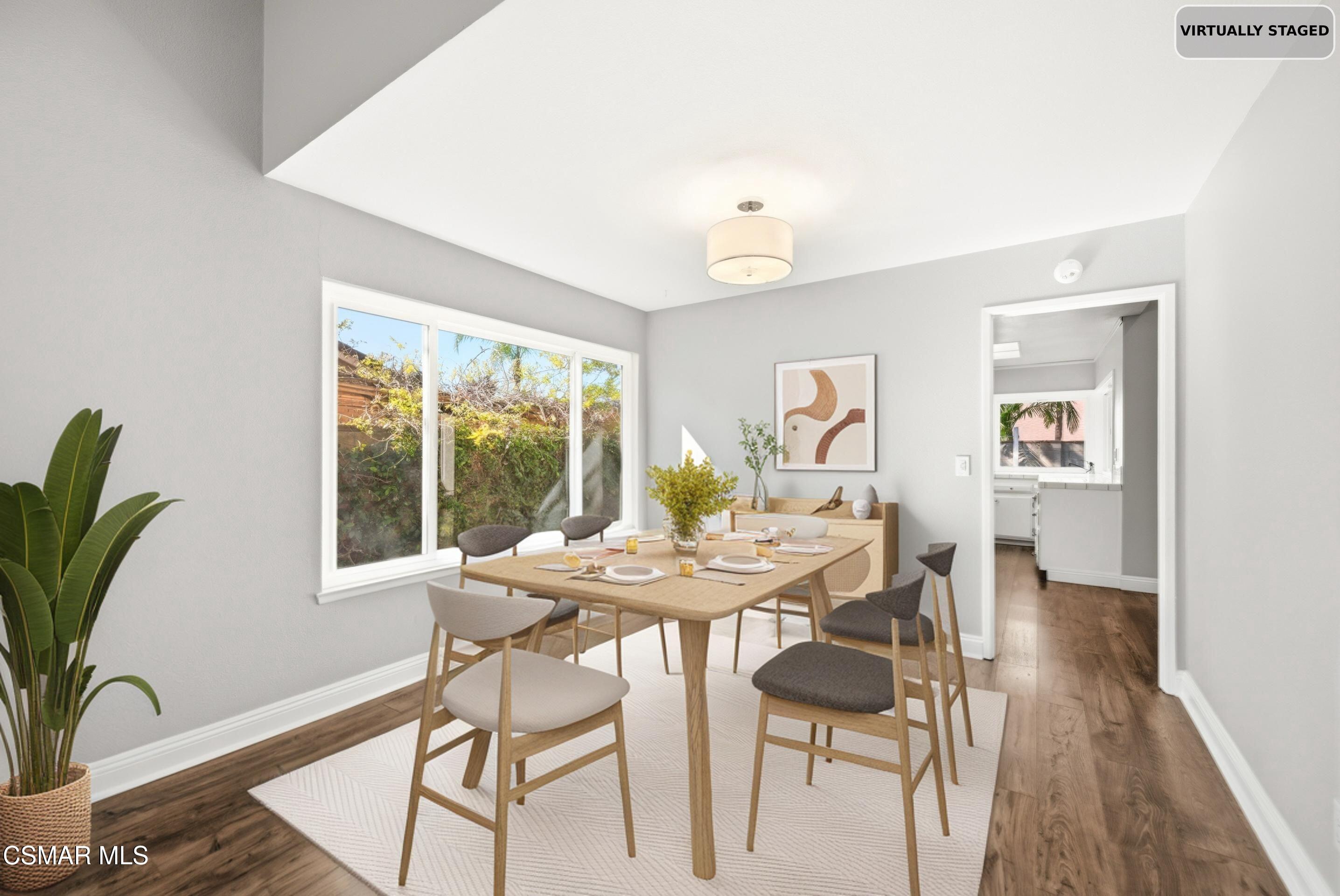 2249 St Clair Avenue Simi Valley, CA 93063 - Photo 14 of 60 a view of a dining room with furniture window and wooden floor